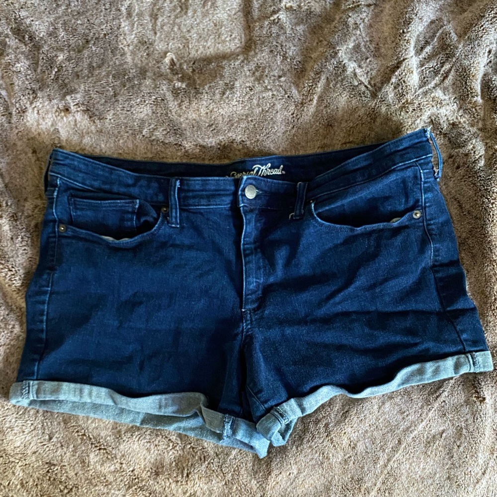 Dark wash mid-rise midi shorts.